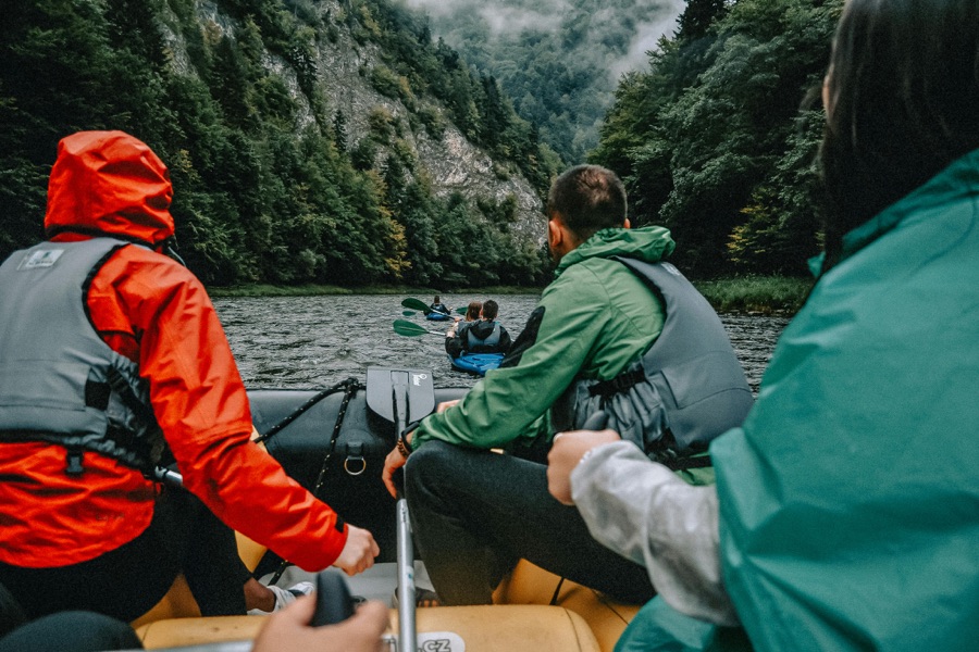 Friends kayaking together